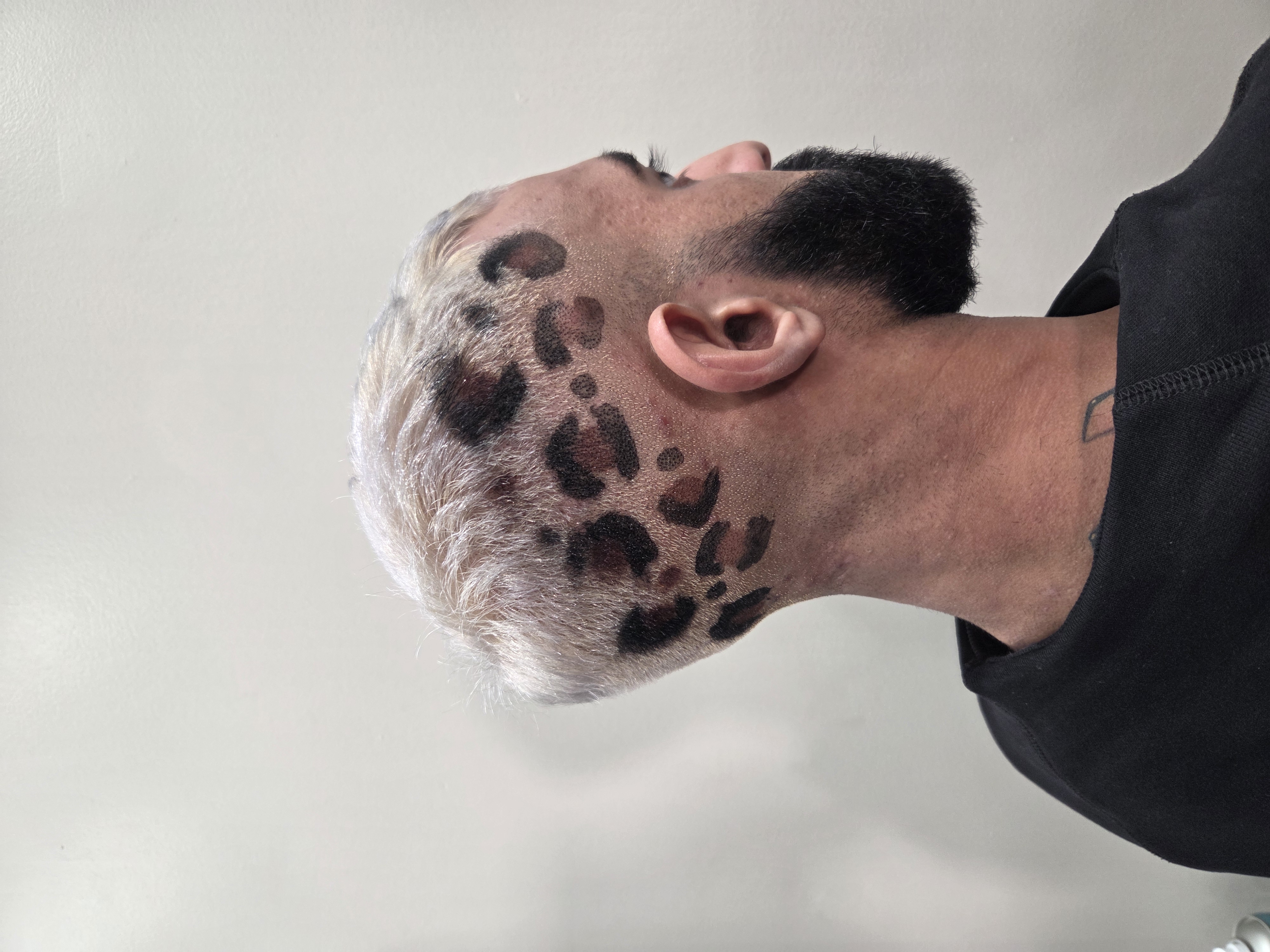 Creative leopard print hair design with platinum blonde