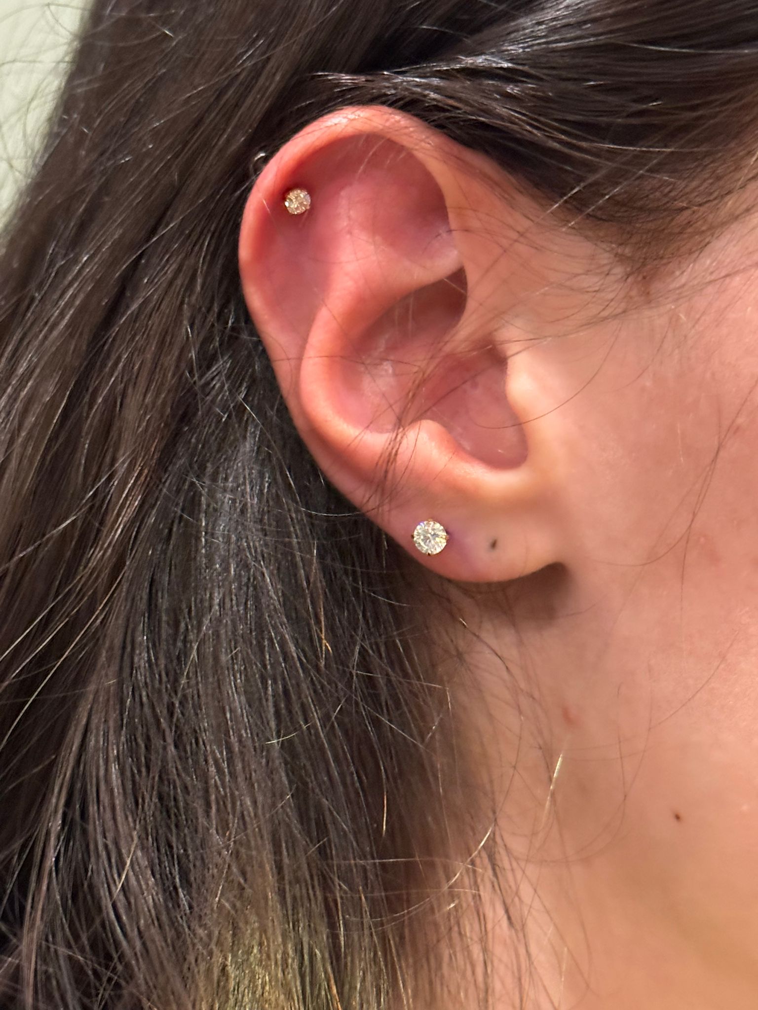 Helix and lobe piercings with diamond studs